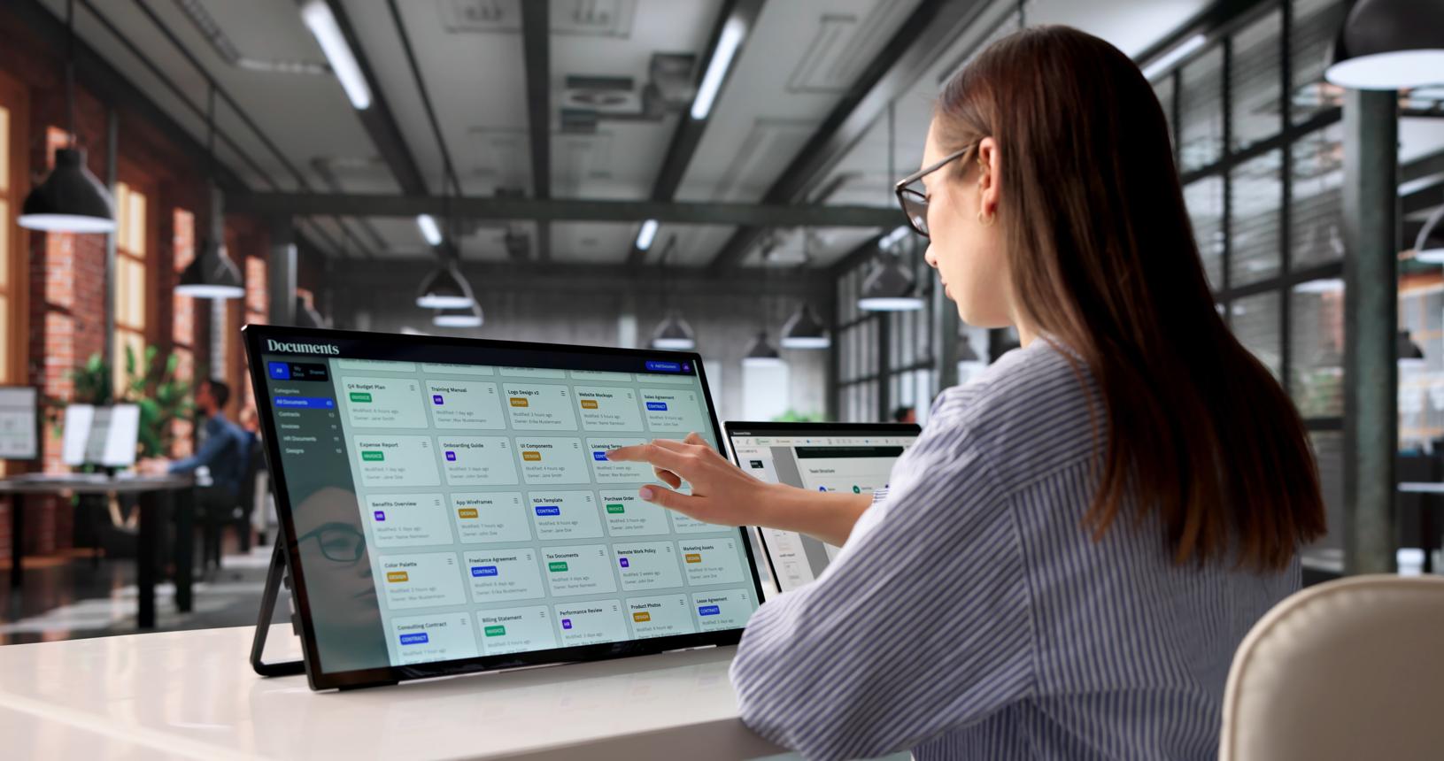 User working with document cards on a large screen